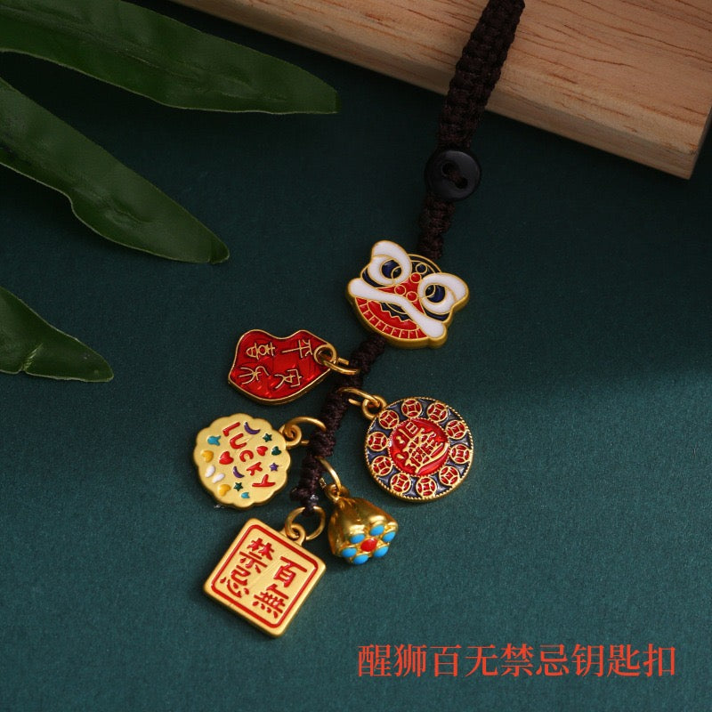 A red lucky charm hanging ornament with intricate details and traditional Chinese elements, featuring various auspicious symbols and knots.