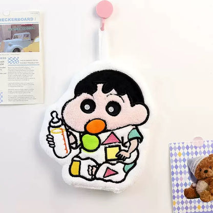 Plush toy of a cartoon character holding a bottle and playing with blocks on a white background.