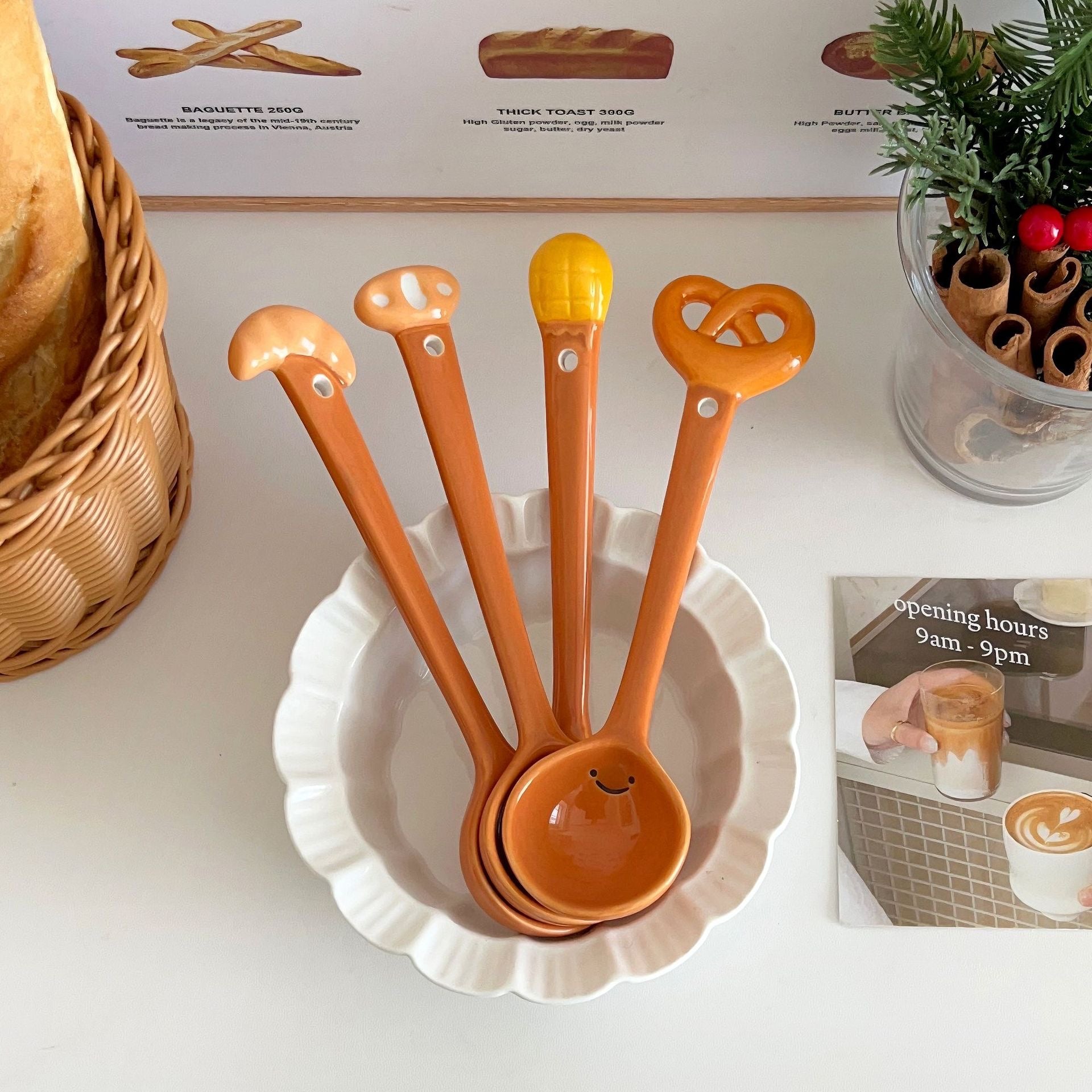 Set of 4 cute ceramic measuring spoons with snack-themed handles, including pretzel, bread, waffle, and paw designs.