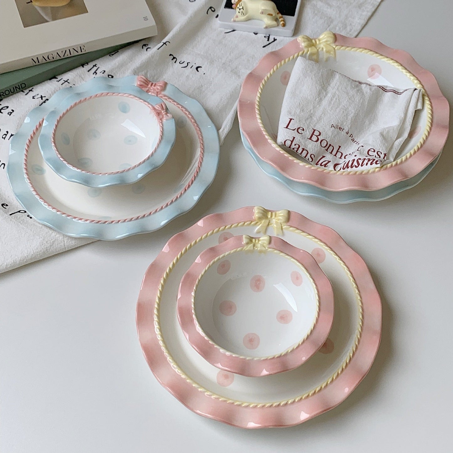 Aesthetic polka dot ceramic tableware set with pastel colors, bowknot accents, and wavy edges, perfect for stylish dining.