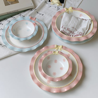 Aesthetic polka dot ceramic tableware set with pastel colors, bowknot accents, and wavy edges, perfect for stylish dining.