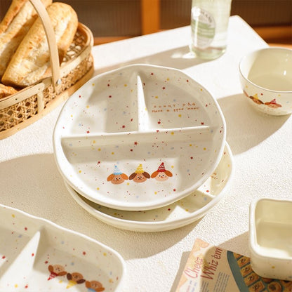 Children's ceramic plate with cartoon characters on a table with bread and water.