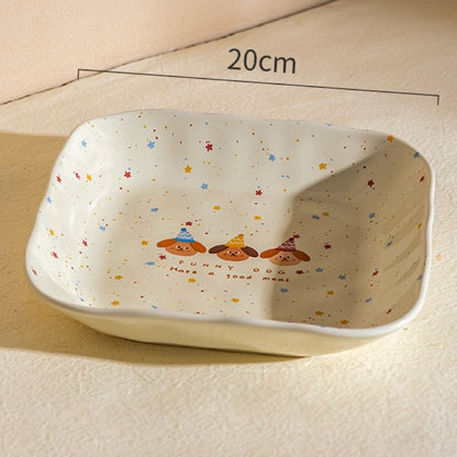 Rectangular ceramic dish with cartoon dog design and measurements on a beige background