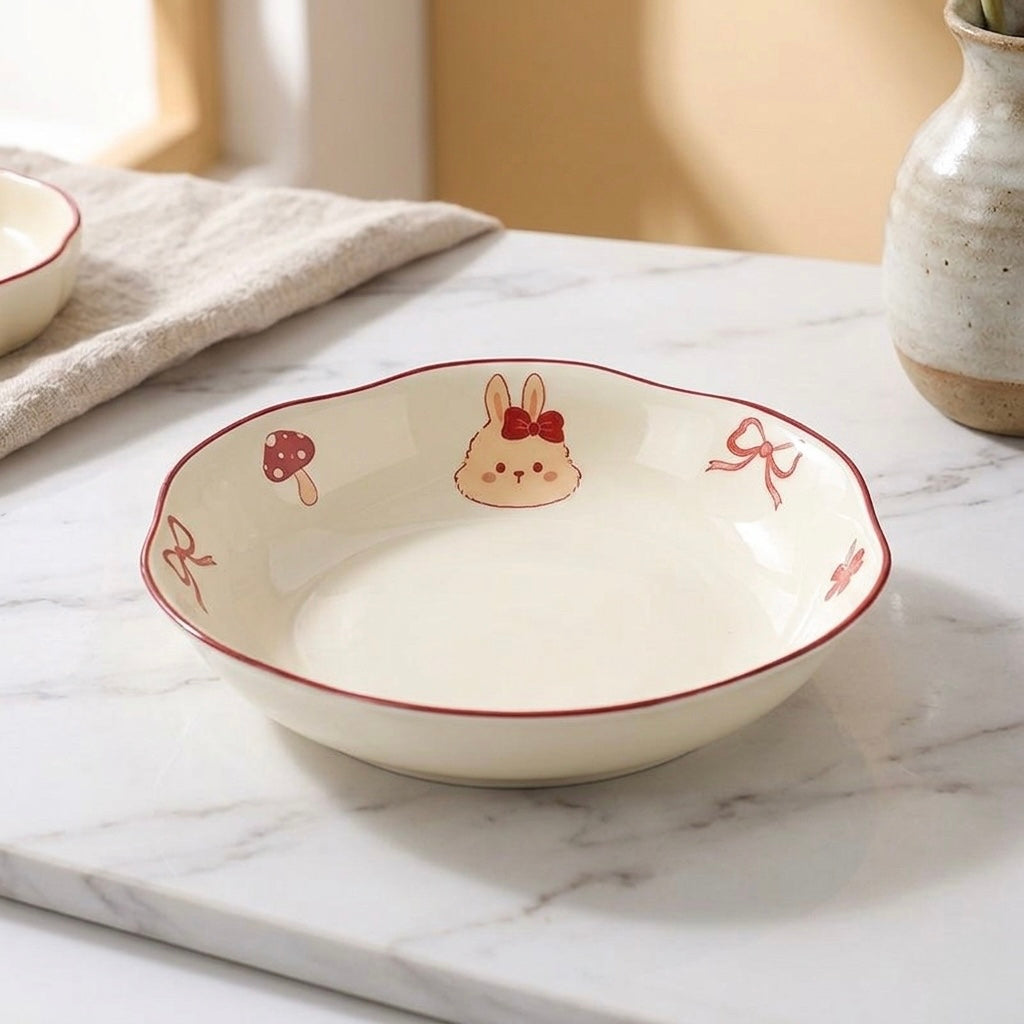 Ceramic bowl with cartoon rabbit design on a marble surface