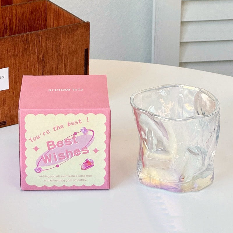 A collection of irregular glass cups with a wavy texture, displayed in various translucent colors such as pink, blue, and green, without packaging.