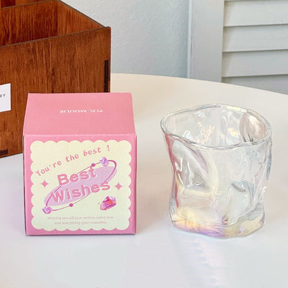 A collection of irregular glass cups with a wavy texture, displayed in various translucent colors such as pink, blue, and green, without packaging.