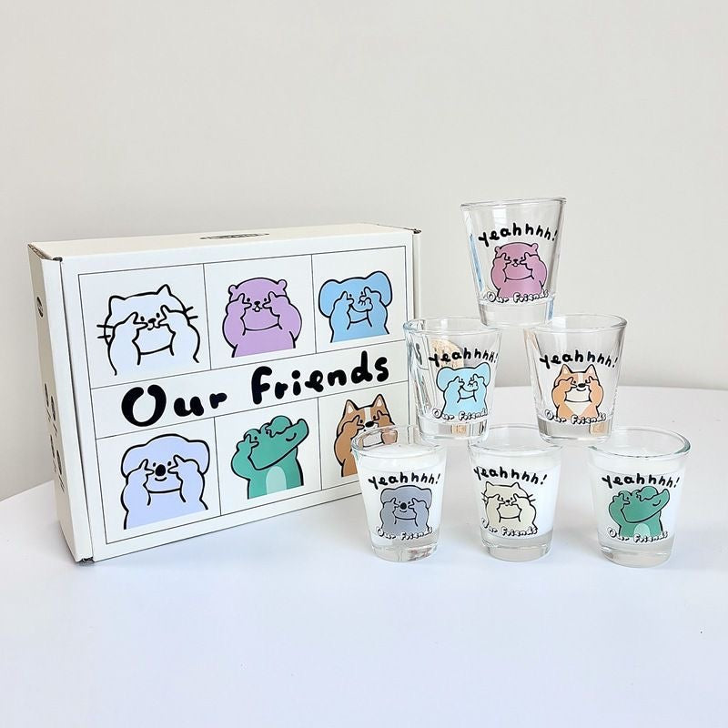 Set of shot glasses with cartoon animal designs and a box labeled 'Our Friends' on a white background.