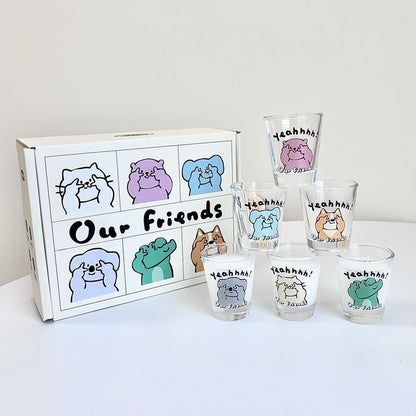 Set of shot glasses with cartoon animal designs and a box labeled 'Our Friends' on a white background.