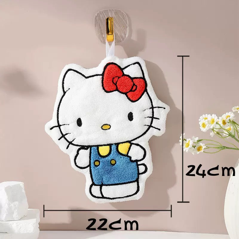 Hello Kitty plush toy with measurements on a neutral background