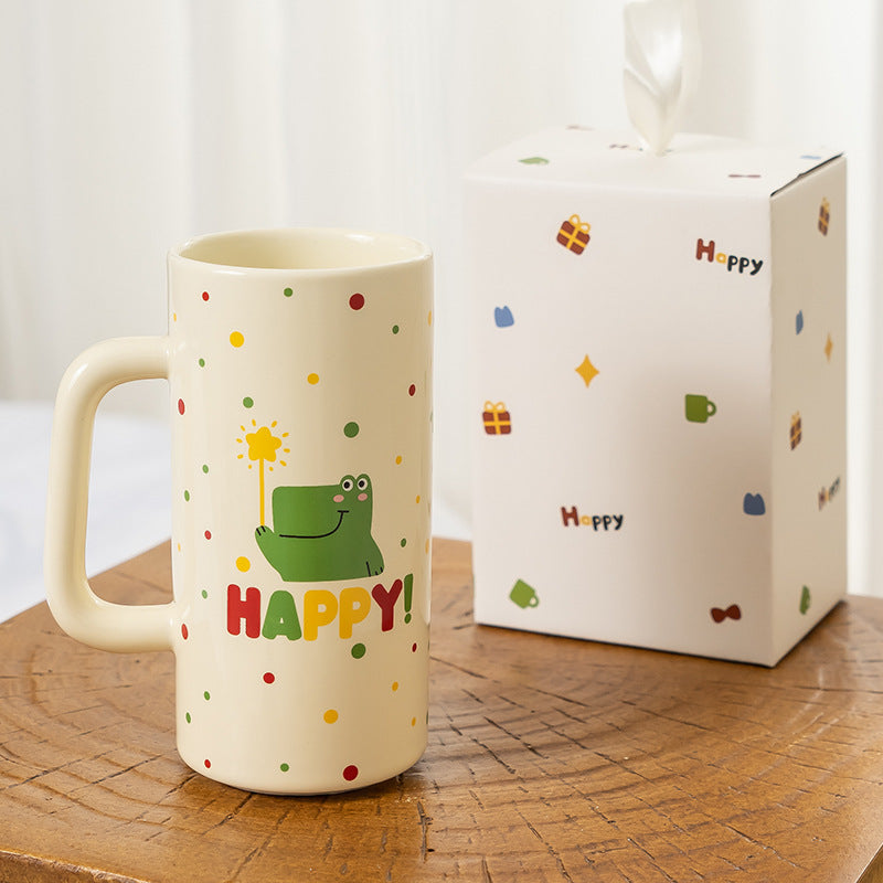 Ceramic mug with dinosaur design shown with matching gift box packaging